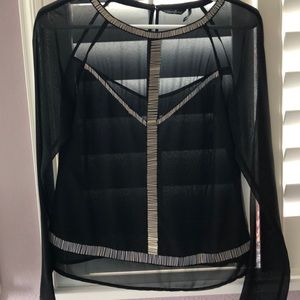 Sheer see through long sleeves blouse.